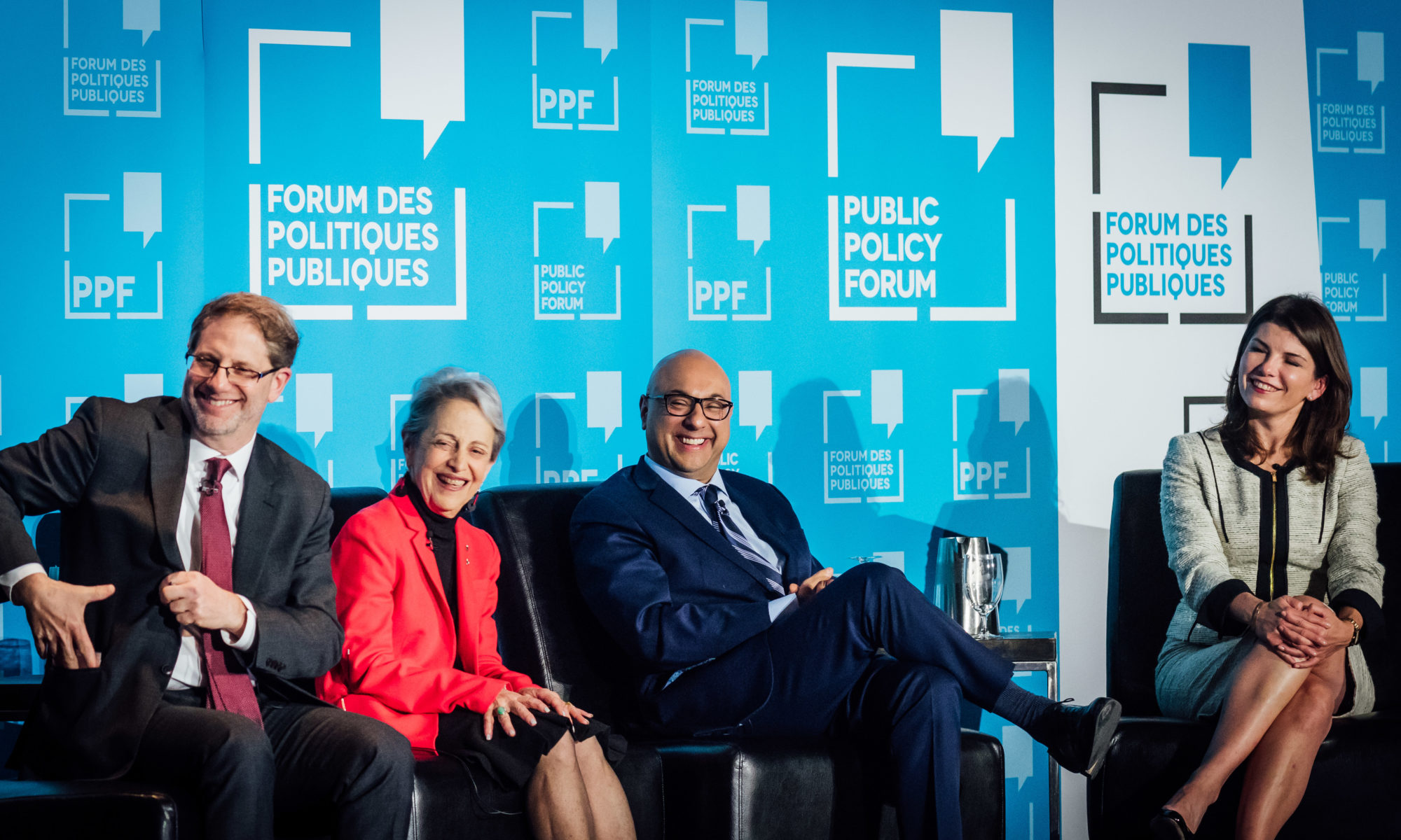 Edward Greenspon, Janice Stein, Ali Velshi and Luiza Savage smile on stage