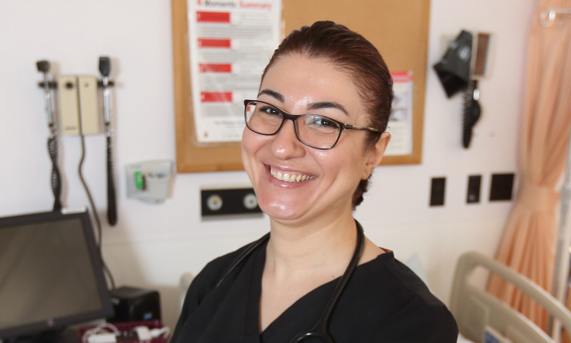 Nadine Ezzeddine poses inside the Nursing Simulation lab at Dalhousie University on March 20, 2019 in Halifax, Nova Scotia, where she teaches. When Ezzeddine arrived in Canada with years of health care experience and three degrees, she struggled to find work as a nurse. Now employed and on track to become a permanent resident, her advice for others is to 'be patient'. Photo by Mike Dembeck.