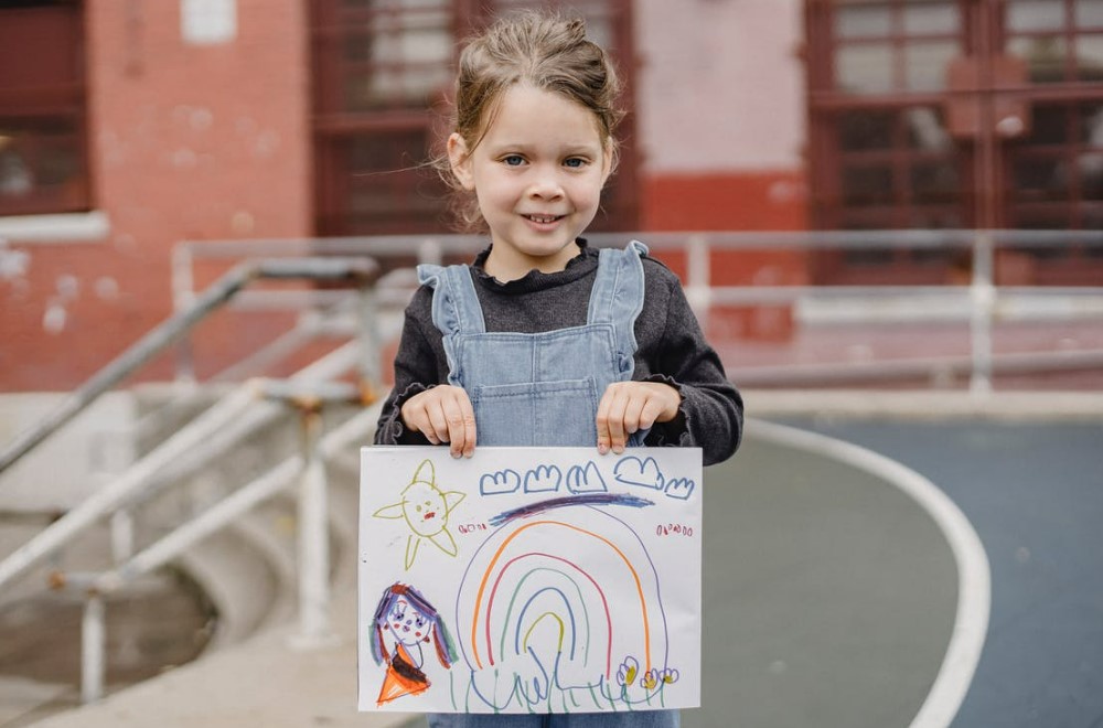 a girl with her drawing