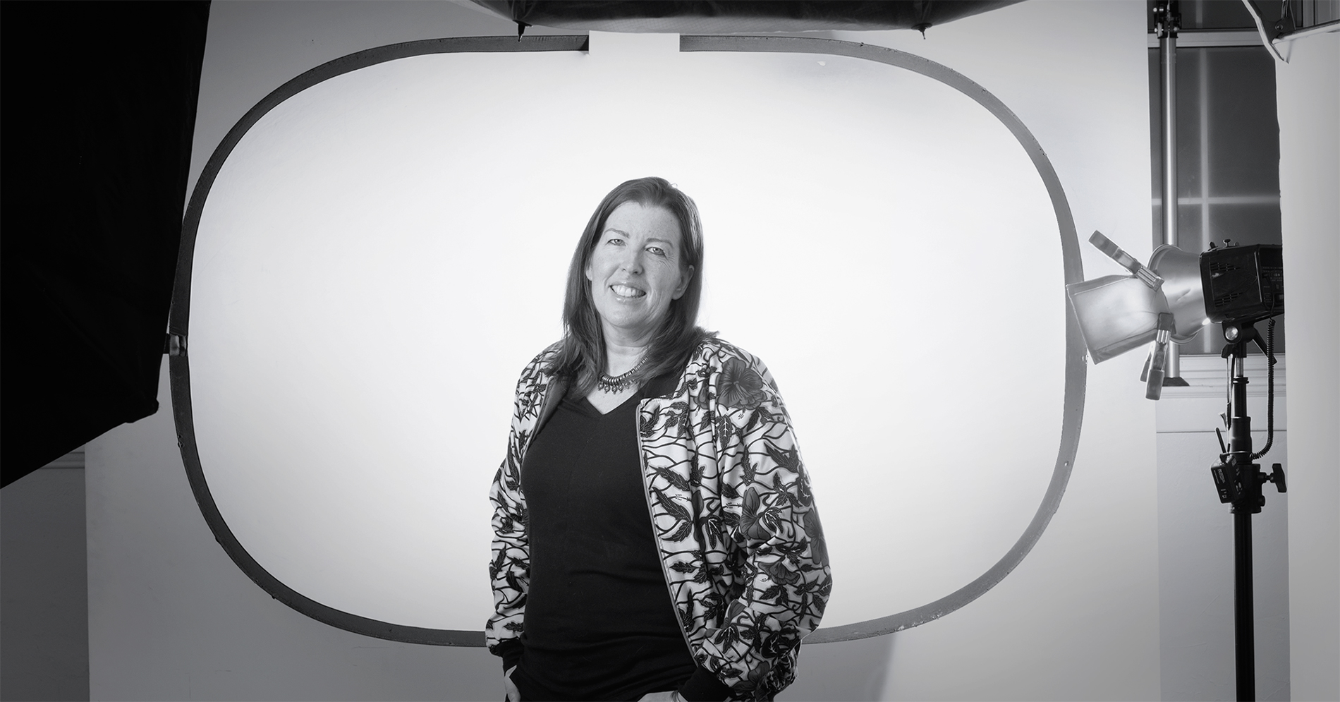 Stephanie Nolan standing in front of photograph equipment