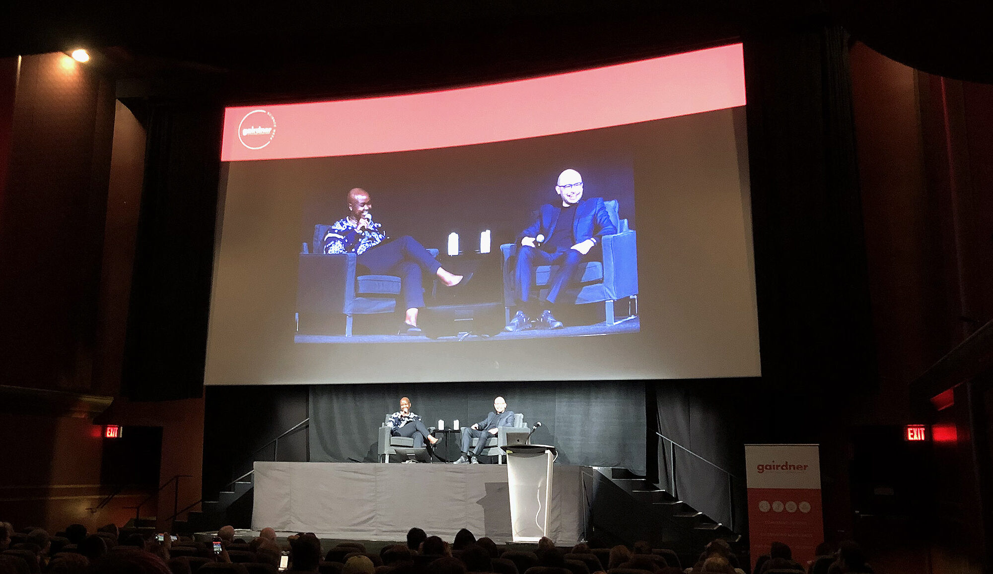 Shingai Manjengwa and Demis Hassabis onstage at an event